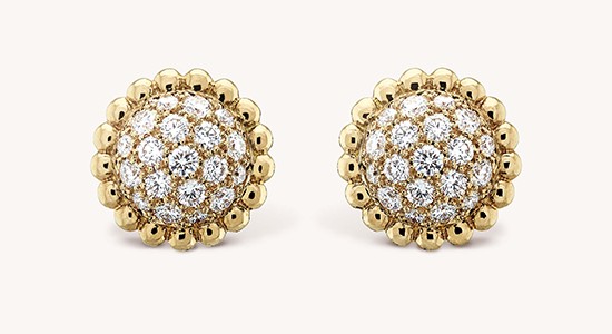a pair of yellow gold diamond stud earrings with beaded details