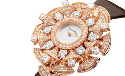 A close-up of a stunning and ornate BVLGARI watch studded with diamonds, available at LV Luxury Jewelers.