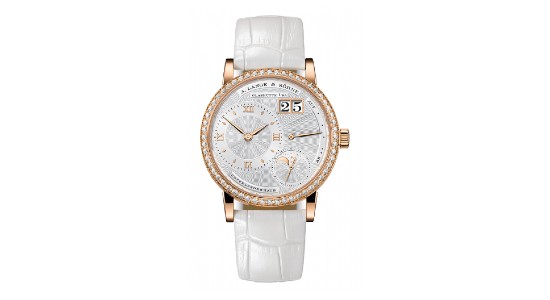 a watch with a number of complications, a white watch dial and strap and a rose gold case