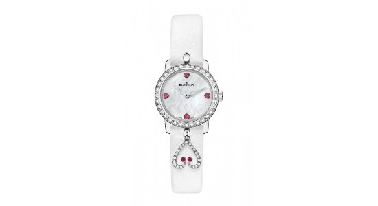 a silver watch with a white dial and strap and heart motif accents