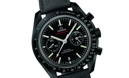 A close-up of a rugged all-black Omega Speedmaster watch, available at Horologio presented by LV Luxury Jewelers.
