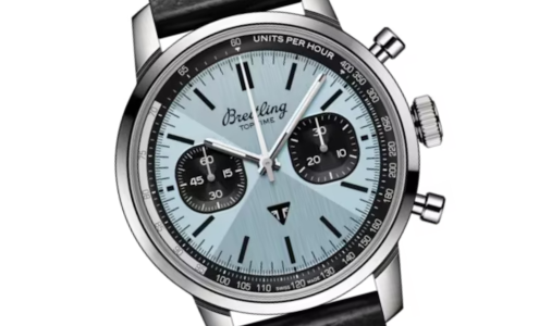 A close-up of a Breitling Top Time Triumph watch with an icy blue dial, available at Horologio presented by LV Luxury Jewelers.