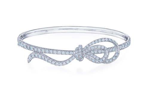 An eye-catching platinum and diamond Kwiat bangle with a ribbon detail, available at LV Luxury Jewelers.